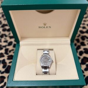 Rolex Silver Watch with Diamond Accents